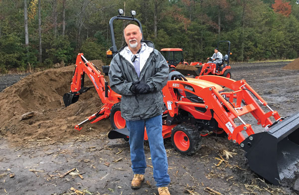 Giving the lowdown Despite the chilly, rainy day, Ron Morgan, territory manager at Kioti Tractor, provides information on the new developments within Kioti’s tractor lineup during the Kioti Ride & Drive dealer event near Raleigh, N.C., on Nov. 12. (Photo: Sarah Webb)