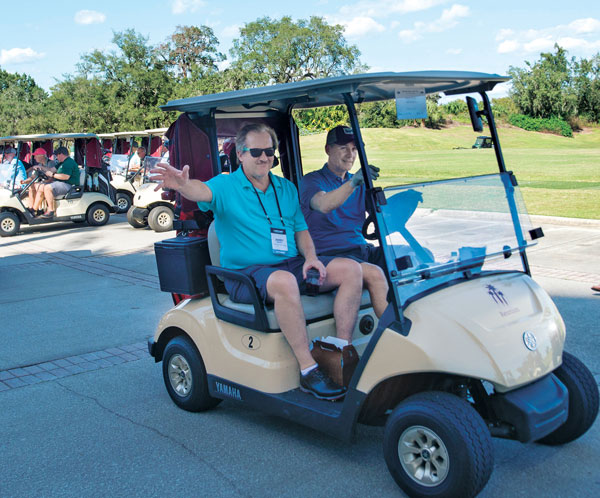 LM’s Bill Roddy and Lawn Doctor’s Jerry Grutz head off to the first tee at the LM Growth Summit. (Photo: LM Staff)