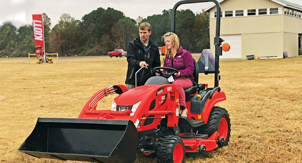 Kioti’s Greg Bibee gives LM’s Sarah Webb the rundown on Kioti’s CS2210 tractor. (Photo: Kioti)