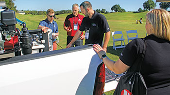 Lawn care operators checking out equipment at LM Growth Summit (Photo: Seth Jones)
