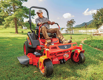 Man mowing with a ride-on machine (Photo: Kioti)