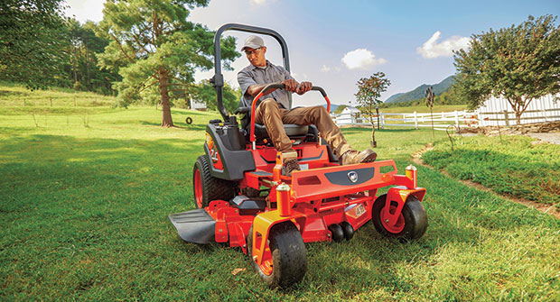 Man mowing with a ride-on machine (Photo: Kioti)