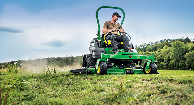 Man riding zero-turn mower (Photo: John Deere)