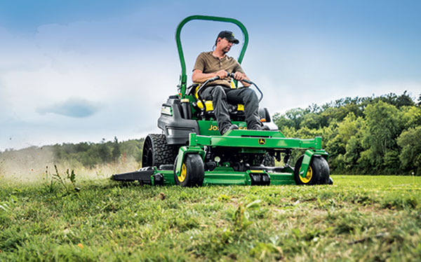 Man riding zero-turn mower (Photo: John Deere)