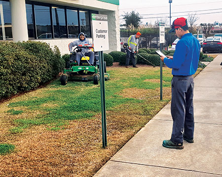 Man on a John Deere mower with electronic fuel injection. (Photo: Jody Sepulvado)