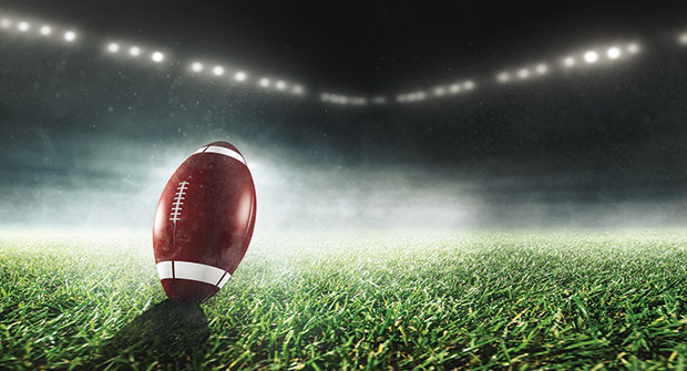 Football in stadium (Photo: Marcus Millo/iStock / Getty Images Plus/Getty Images)