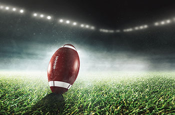 Football in stadium (Photo: Marcus Millo/iStock / Getty Images Plus/Getty Images)