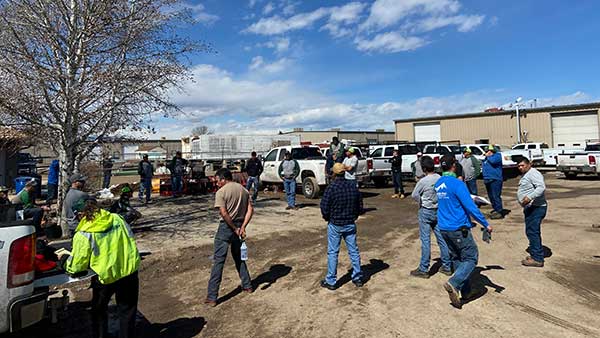 Longs Peak employees hold a meeting while practicing social distancing. (Photo: Mike DePriest)