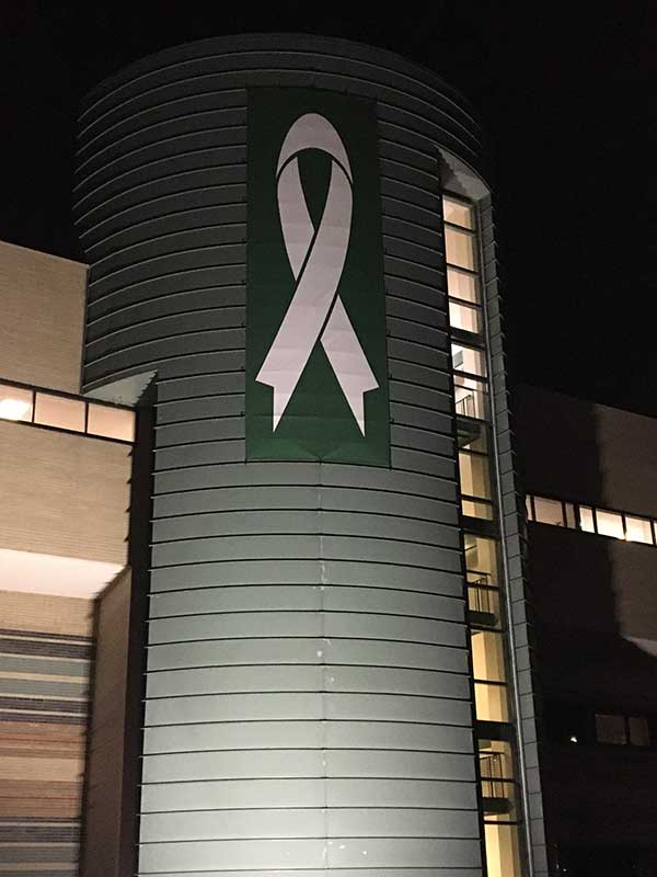 The banner lit up at night. (Photo: D&B Landscaping)