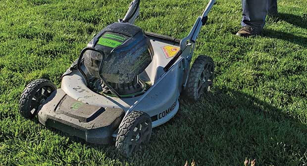 Crew member mowing (Photo: Phoenix Landscape Management)
