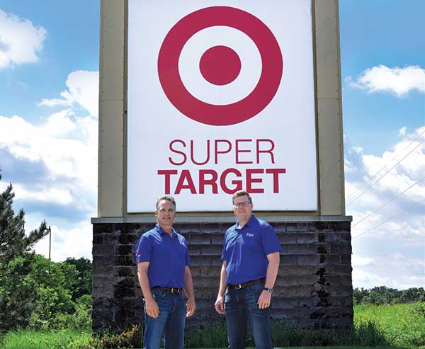 Conserva employees in front of Target Superstore sign (Photo: Conserva Irrigation)