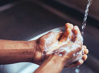 Person washing hands (Photo: Moyo Studio/E+/Getty Images)