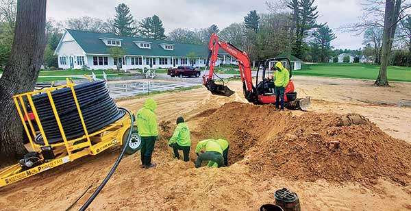 Crews performing golf course irrigation service (Photo: Winterberry Gardens)