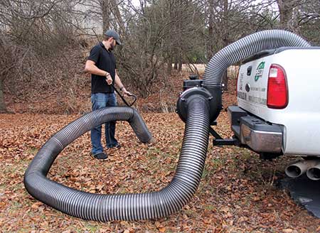 Person performing fall cleanup (Photo: Peco)