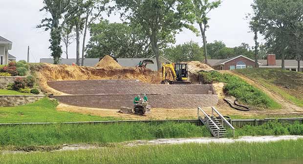 Compact excavator at work (Photo: ProGreen Turf and Landscape)