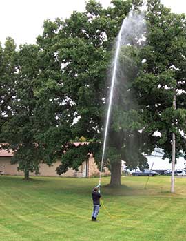 Man spraying tree (Photo: Gregson-Clark Spraying Equipment)