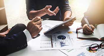 Businesspeople in meeting (Photo: Jirapong Manustrong/iStock / Getty Images Plus/Getty Images)