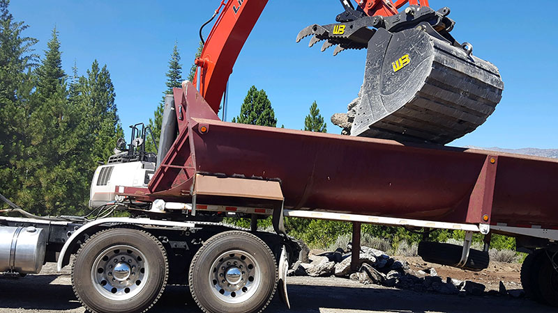 Werk-Brau's new productivity package includes a heavy-duty excavator bucket, progressive linkage thumb and D-lock coupler for added versatility on job sites. (Photo: Werk-Brau)