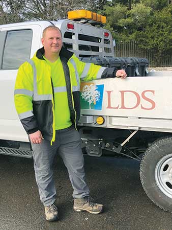 Tim Koehler in front of LDS truck (Photo: Landscape Design Services)