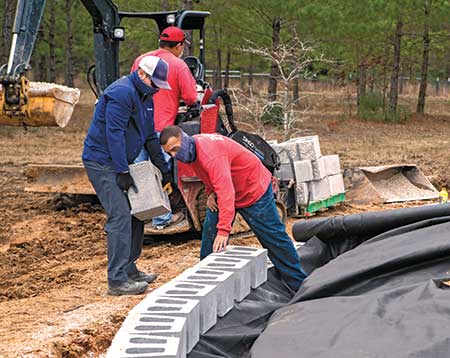 Crews installing hardscape element (Photo: Belgard)