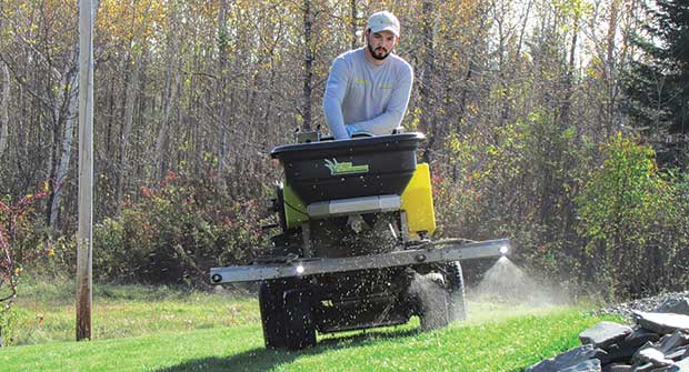 Person spreading fertilizer (Photo courtesy of Patrick Vaillancourt)