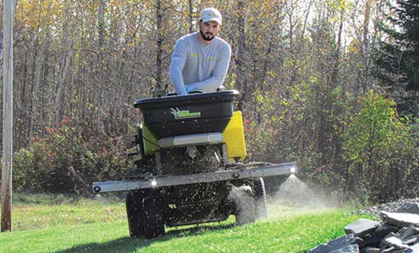 Person spreading fertilizer (Photo courtesy of Patrick Vaillancourt)