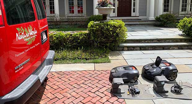 Robotic mowers and NatureWorks van (Photo: NatureWorks)