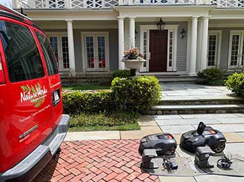 Robotic mowers and NatureWorks van (Photo: NatureWorks)