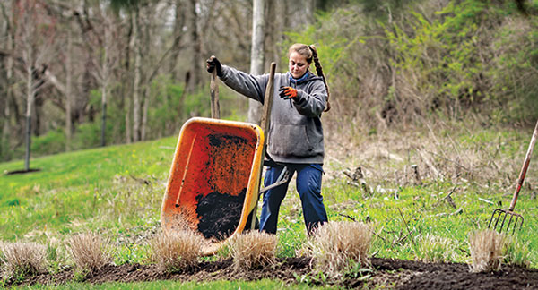 Eichenlaub apprentice Megan Wolfgang performs landscape maintenance. (Photo: Eichenlaub)