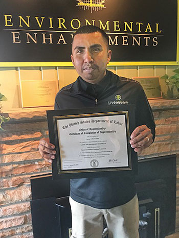 Hector Marin, Environmental Enhancements IPM manager, with his U.S. Department of Labor certificate. (Photo: Environmental Enhancements)