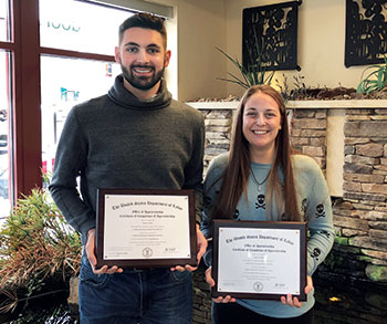 Zachary Pulcini and Megan Wolfgang of Eichenlaub show off apprenticeship certificates. (Photo: Eichenlaub)