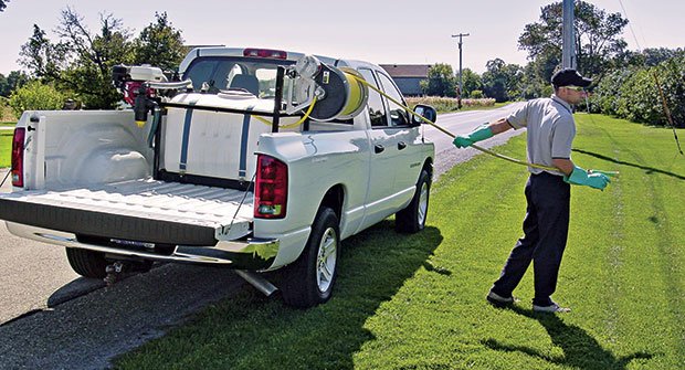 Man operating spray rig (Photo: Hannay Reels)