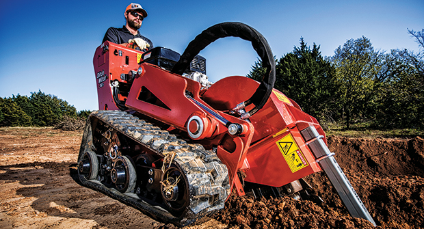 A landscaper uses Ditch Witch’s C12X walk-behind trencher. (Photo courtesy of Ditch Witch)