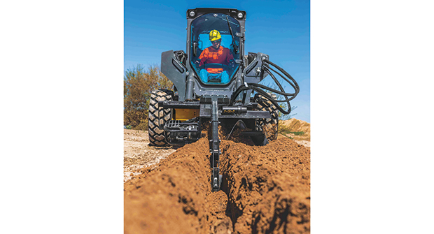A John Deere track loader uses a trencher attachment. (Photo courtesy of John Deere Construction)