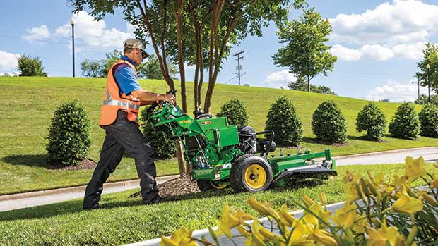 Easy access: Commercial walk-behind mowers can access items other mowers can’t, such as parking lot islands. (Photo: John Deere)