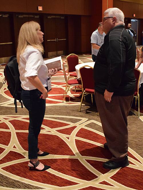 Yellowstone Landscape Director of Business Optimization Christina Franzen talks to Aspire Software Chief Product and Technology Officer Dan Blake (Photo:LM Staff)