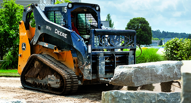 Backyard access: DeHamer Landscaping relies on compact equipment to get into backyards and other tight spaces for jobs such as installing retaining walls (Photo: Marvin Shaouni).