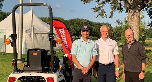 From left: Village Development Director David Newman, Doosan Bobcat President Mike Ballweber, Open Tournament Director Mark Johnson 2021. (Photo courtesy of Bobcat Co.)