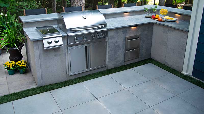Belgard introduced Artforms, a modular concrete panel system and Elements, a product line of stainless steel appliances. (Photo: Belgard)