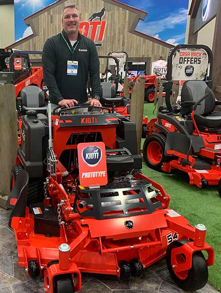 Landscape Management Associate Publisher Craig MacGregor hops on a Kioti mower prototype at the 2021 GIE+EXPO show. (Photo: LM Staff)