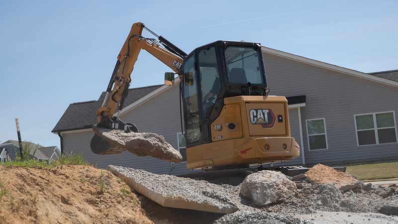 The narrow track of Cat's new 304 mini excavator is 10 inches slimmer than the company's 304 E2. (Photo: Cat)