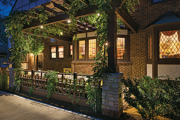 The entertaining space on the south side of the property connects to a small patio for guests of the first-floor resident. (Photo: Landcrafters)