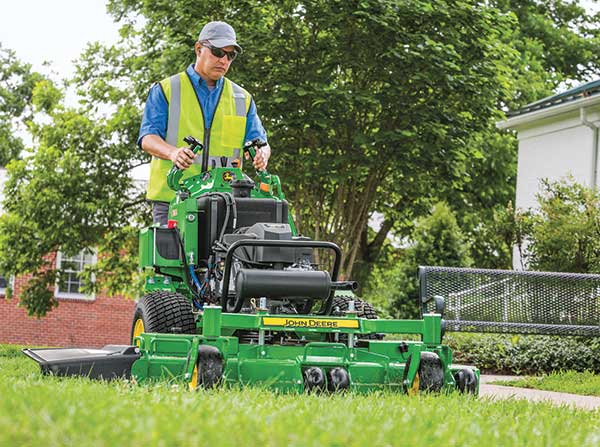 Crew member on mower (Photo: John Deere)