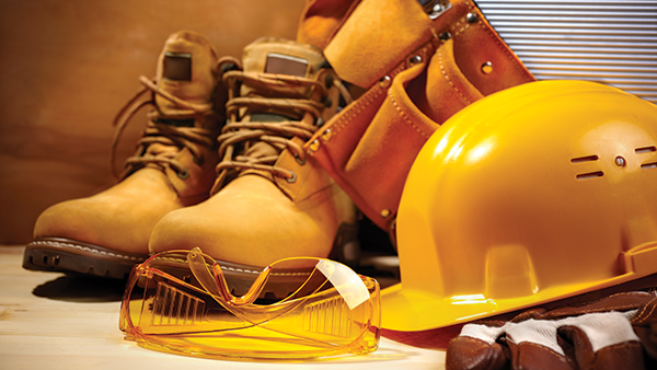 Work boots and safety gear. (Photo: Kuzma / iStock / Getty Images Plus/ Getty Images)