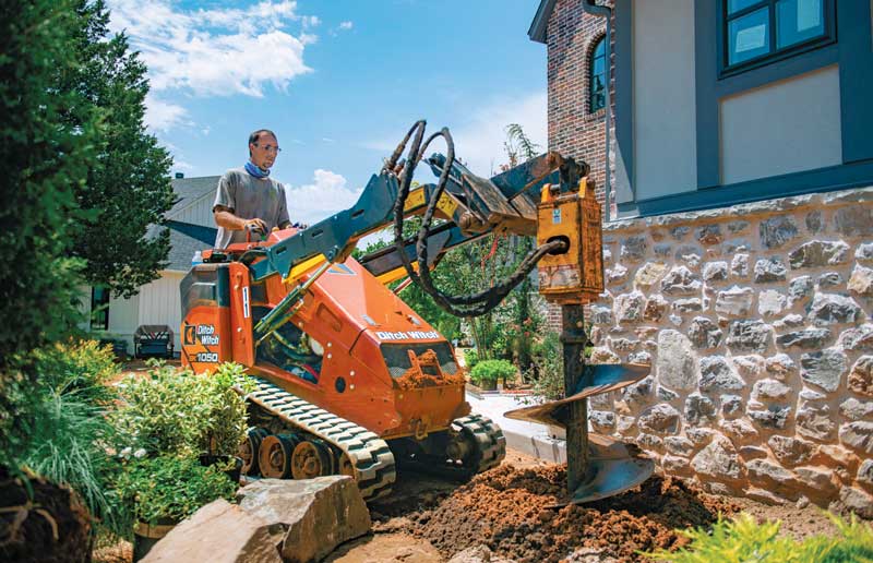 Nelson Landscaping likes to use the Ditch Witch SK1050 stand-on-skid steers due to its size, operating capacity and balance. (Photo: Sundance Photography)