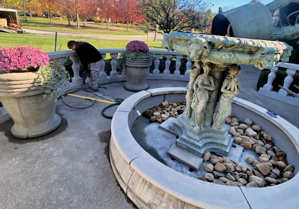 After removing water from a fountain feature, be sure to clean the pump before adding clean water. (Photo: Hidden Creek Landscaping)