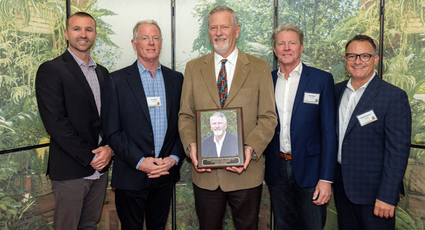 Marty McPhee (center), executive vice president of marketing and sales, Park West, was inducted into the Green Industry Hall of Fame. (Photo courtesy of Park West)