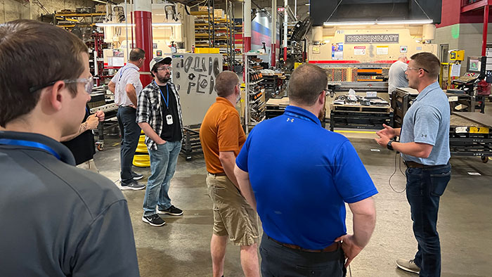 Andrew Knizner, marketing specialist with Ventrac (right) lead Forum for Sales on a tour of the company’s manufacturing facility in Orrville, Ohio. (Photo: LM Staff)