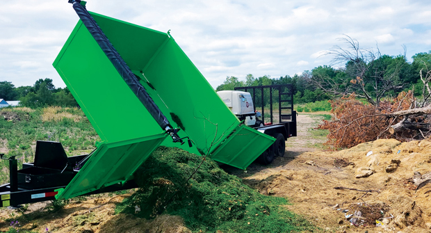 Caleb Gettle, owner of Left Side Lawn Care, worked with D&K Trailers to design a 24-foot custom hydraulic dump trailer with a bull gate to access two mowers and dump on the go. (Photo: Left Side Lawn Care)