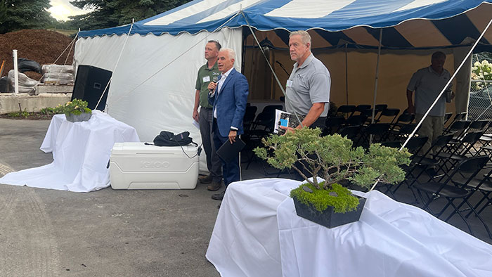 Dale Drier, general manager; Jeffrey Scott and Bob Drost, owner, welcome attendees to the operation's headquarters at Petoskey, Mich. (Photo: LM Staff)